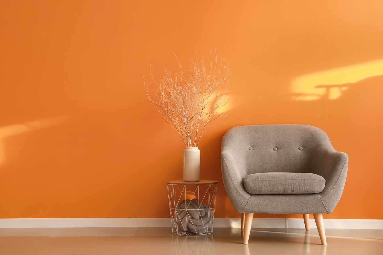 Comfortable Armchair near Orange Wall